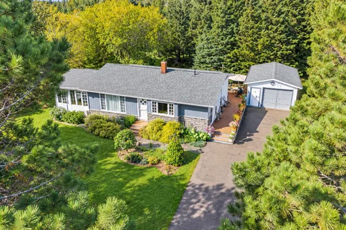 The front of the house and the driveway, seen from the air